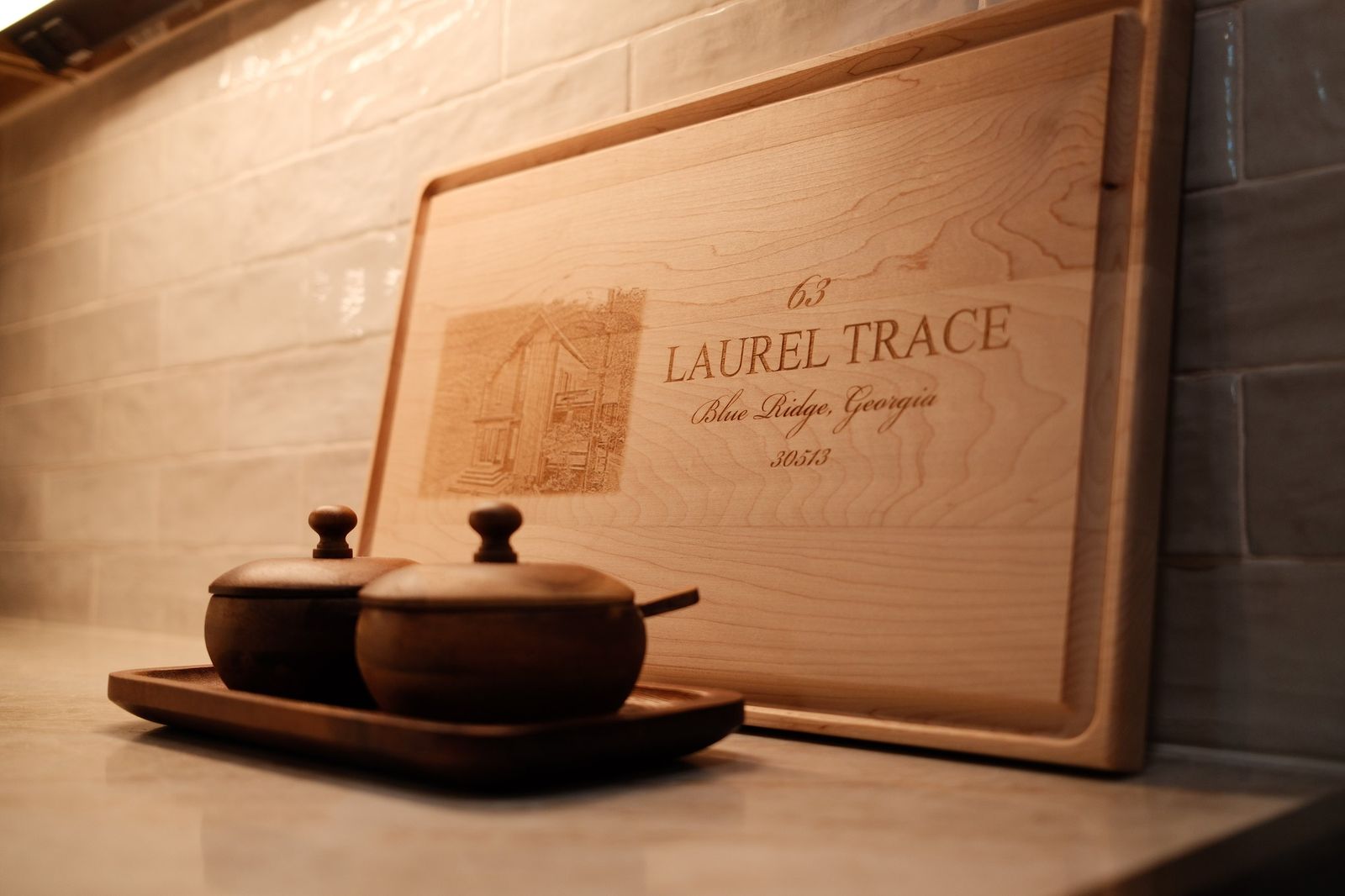 An engraved Laurel Trace cutting board styled in the kitchen